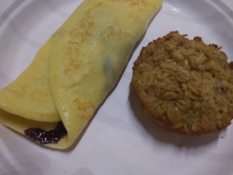 Blueberry crepes and baked oatmeal on a plate. One of many breakfast specialties at Wiscasset Woods Lodge.