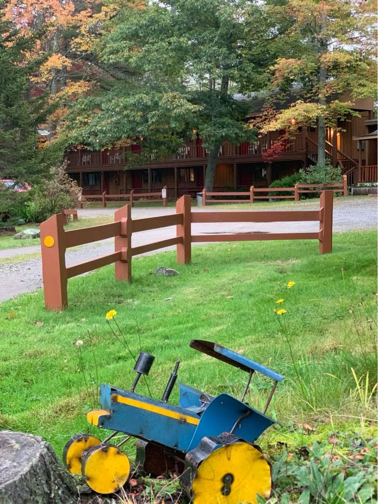 Toy tractor in front of Wiscasset Woods Lodge